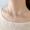 Gold Ribbon Motif Necklace