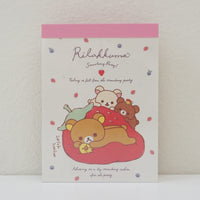big strawberry cushion on memo pad