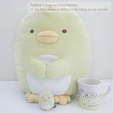 large penguin plush from japan san-x next to mug and small plush